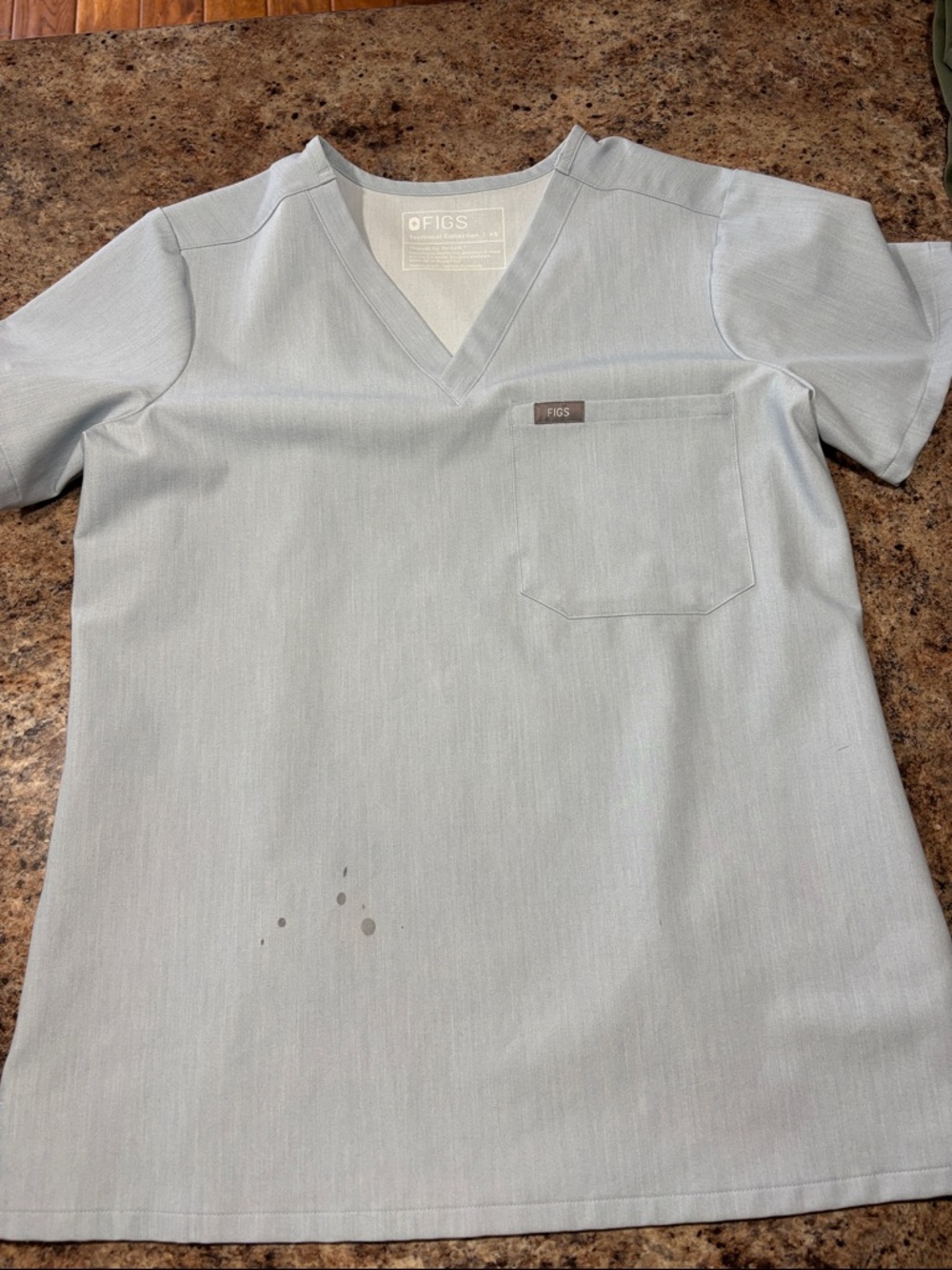FIGS women’s heathered Light Blue V-Neck Scrub Top with Chest Pocket